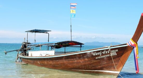 Tranquil Krabi shoreline at dawn for a Krabi Tours banner by Legend Travel Group.
